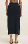 Navy blue skirt worn by a person on a white background