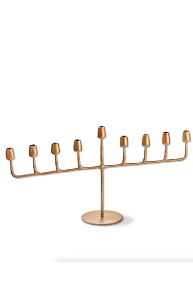 Gold menorah on a white background