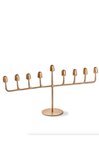 Gold menorah on a white background