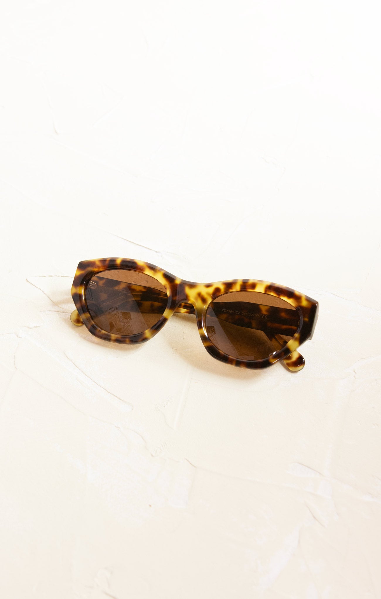 Tortoiseshell sunglasses on a white background