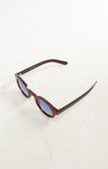Sunglasses with a brown frame and blue lenses on a white background