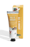 Hand cream with packaging labeled 'All is Bright' on a white background