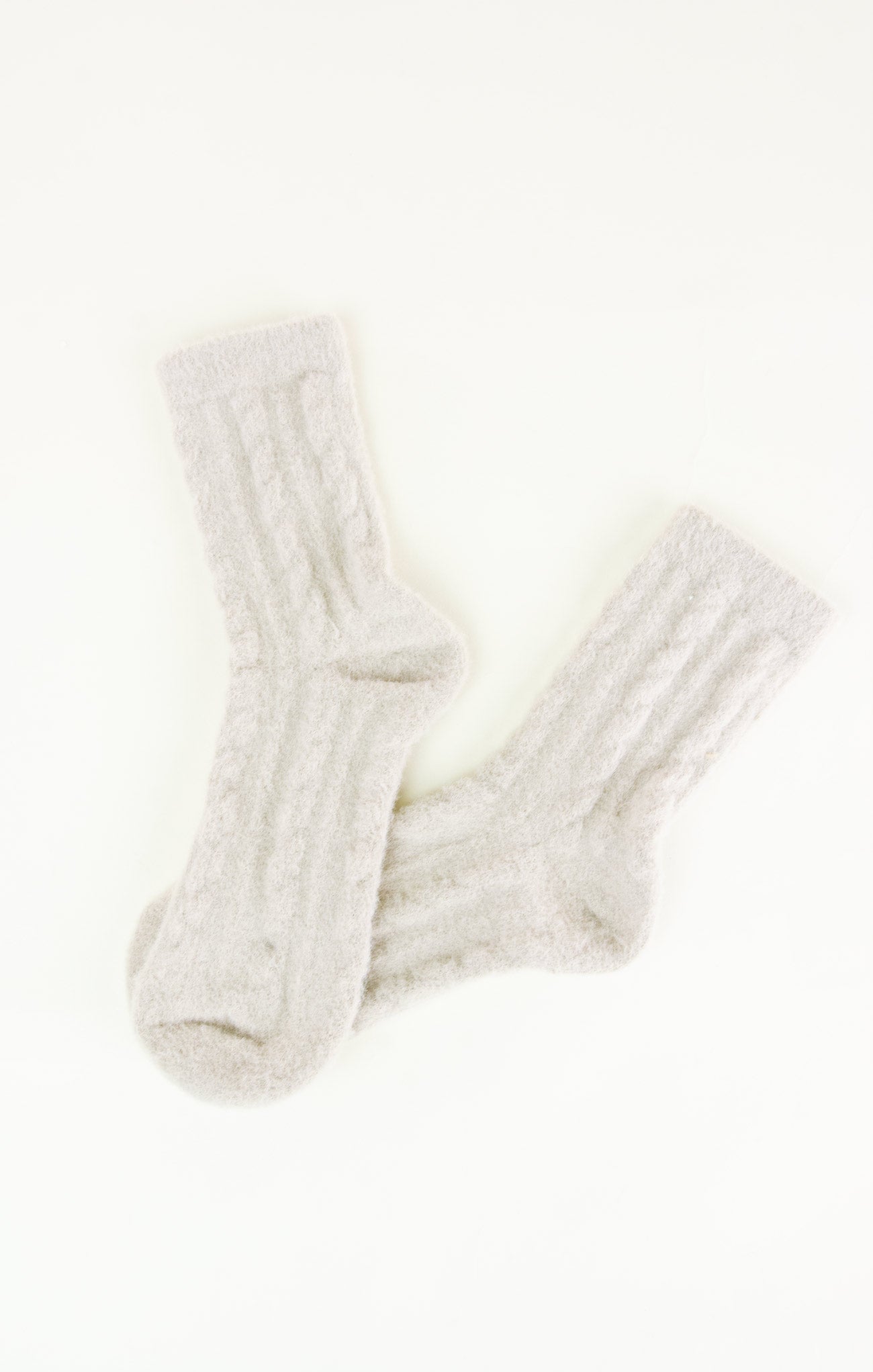 Pair of white socks on a white background