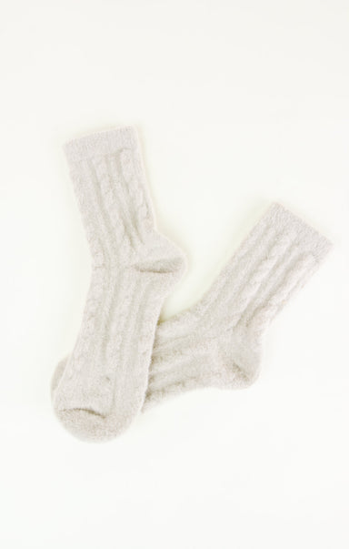 Pair of white socks on a white background