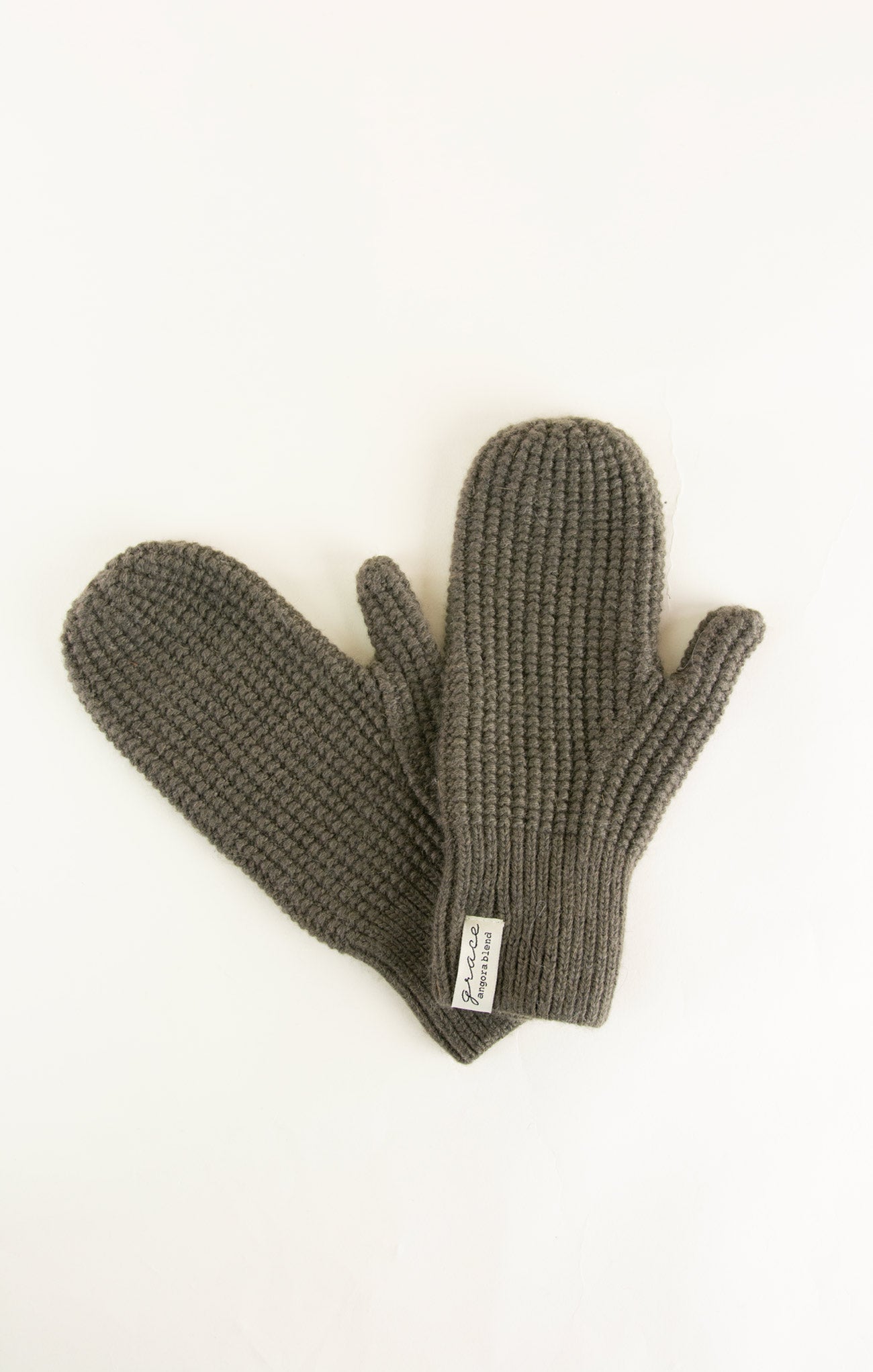 Pair of gray knitted mittens on a white background