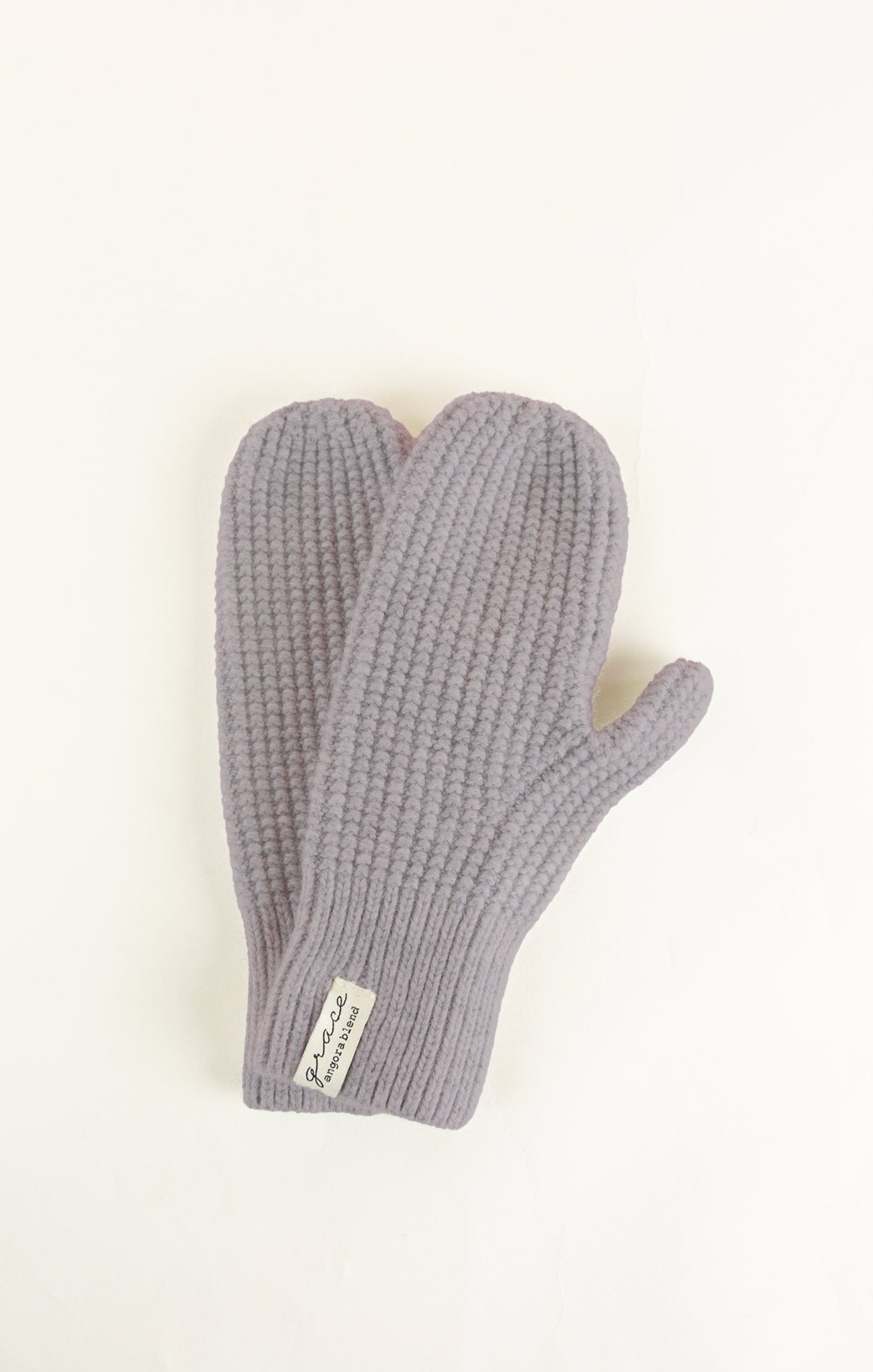 Pair of gray knit gloves on a white background