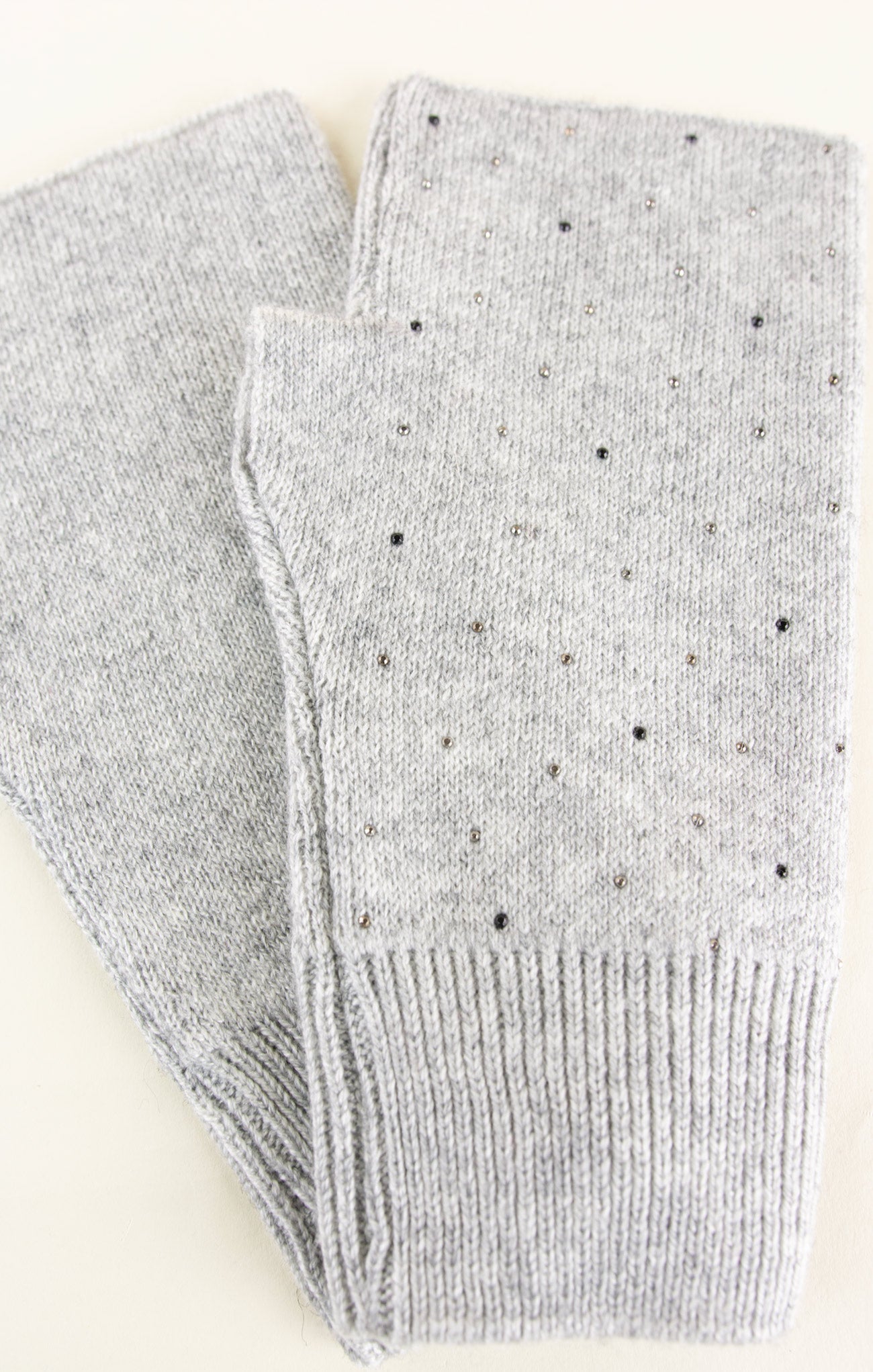 Gray socks with small black dots on a white background