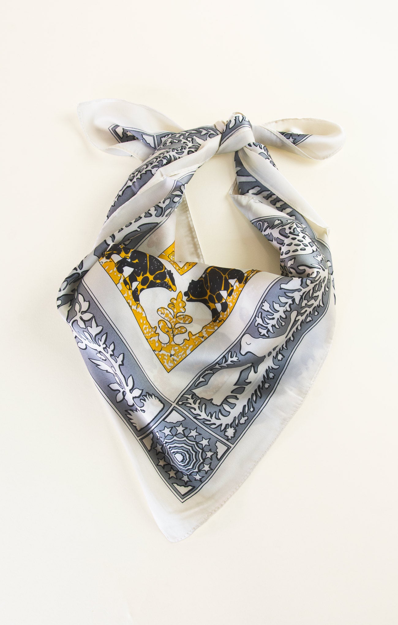 Decorative scarf with intricate patterns on a white background