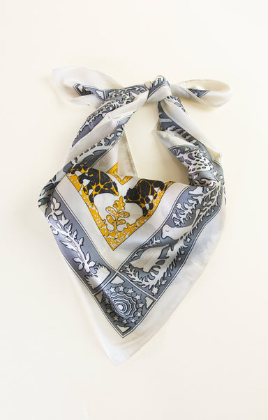 Decorative scarf with intricate patterns on a white background