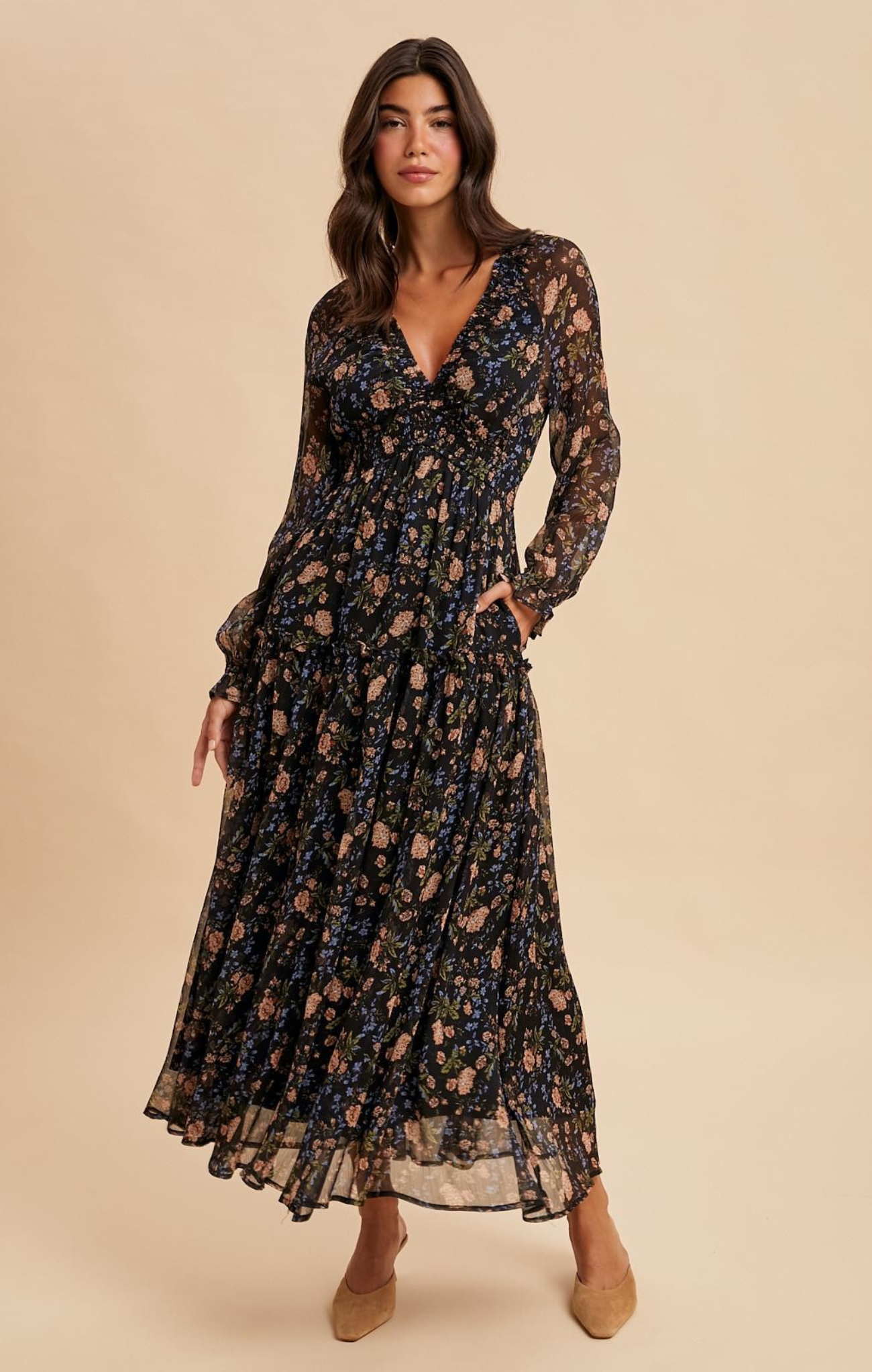 Woman wearing a floral dress on a beige background