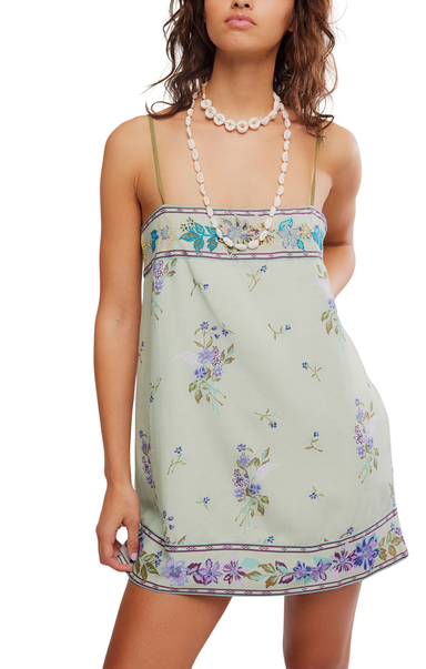 Woman wearing a floral dress with a white background