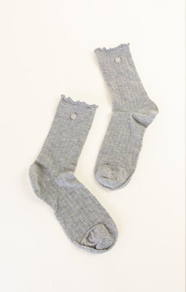 Pair of gray socks with lace trim on a white background