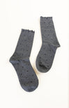 Pair of gray socks with black dots on a white background