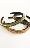 Three decorative headbands with green and gold embellishments on a white background