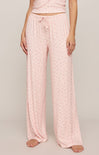 Pink pajama set with drawstring pants on a plain background