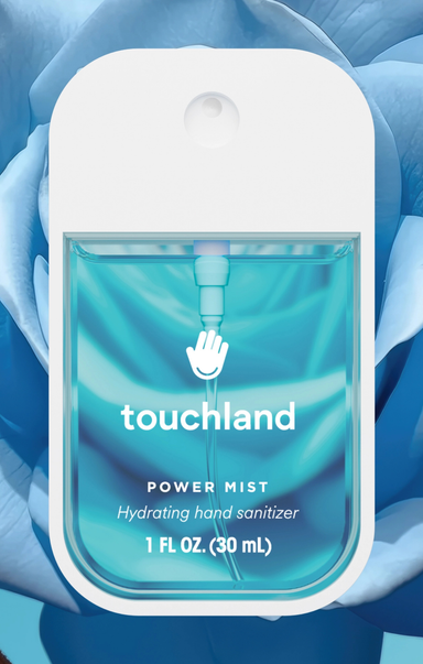 Touchland Power Mist hand sanitizer packaging with blue liquid inside, against a blue floral background.