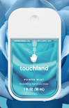 Touchland Power Mist hand sanitizer packaging with blue liquid inside, against a blue floral background.