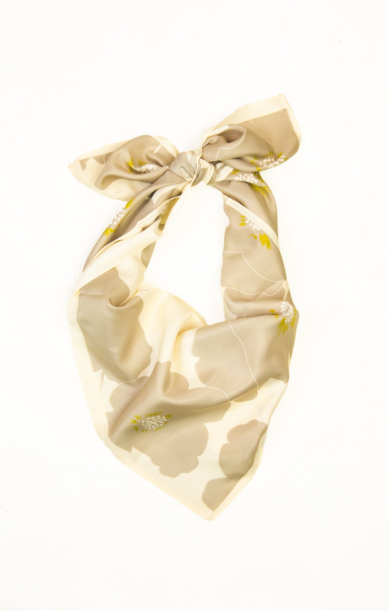 Beige headband with floral pattern on a white background