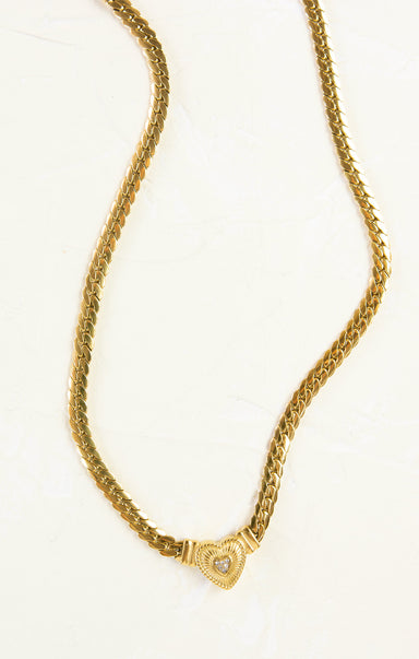 chunky gold chain with gold heart and gem inside heart