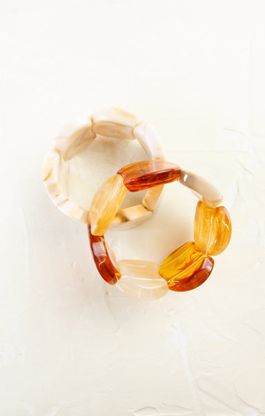 Transparent amber bracelet on a white background
