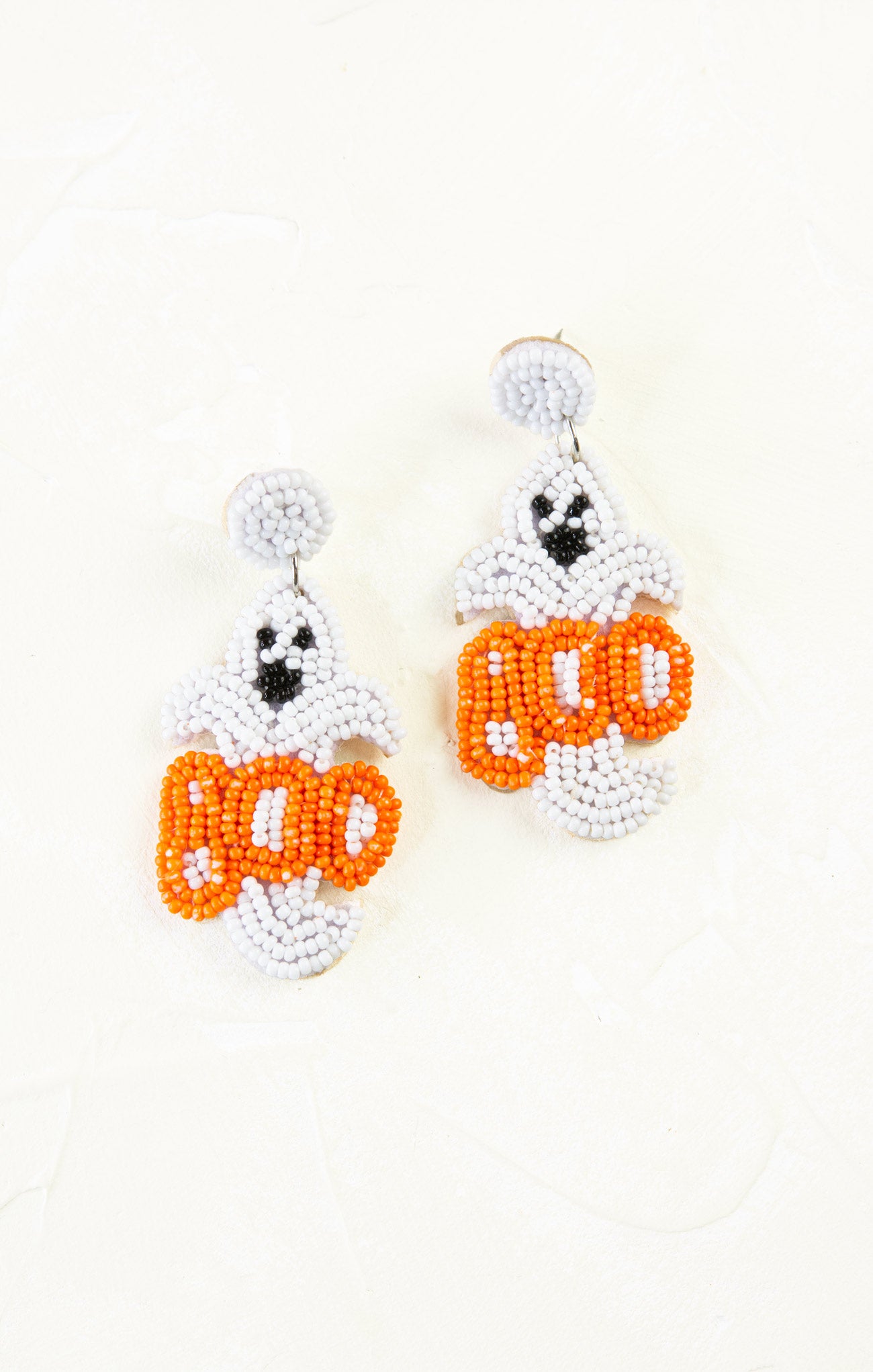 Beaded ghost earrings with 'BOO' text on a white background