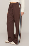 Brown pants with white stripes on a plain background