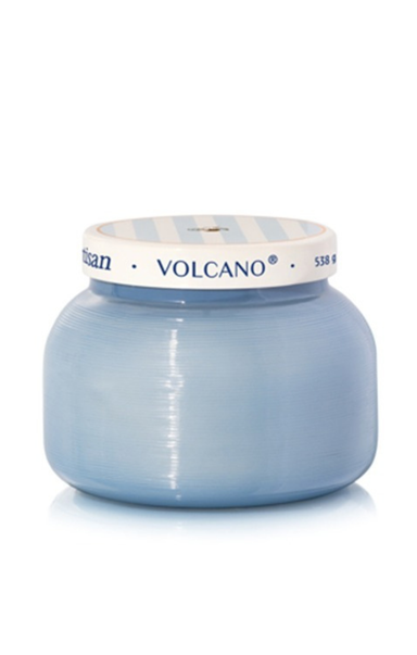 Blue candle jar with striped lid on a white background