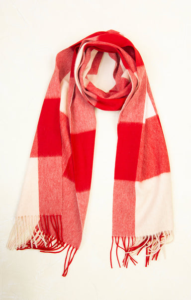 Red and white checkered scarf on a mannequin against a white background