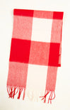 Red and white checkered scarf with fringes on a white background