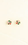 Round earrings with colorful designs on a beige background