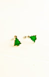 Green tree-shaped earrings on a white background