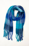 Blue and green plaid scarf with fringes on a white background