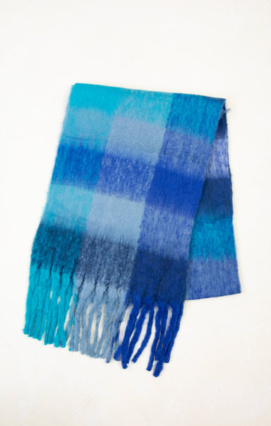 Blue plaid scarf with fringes on a white background