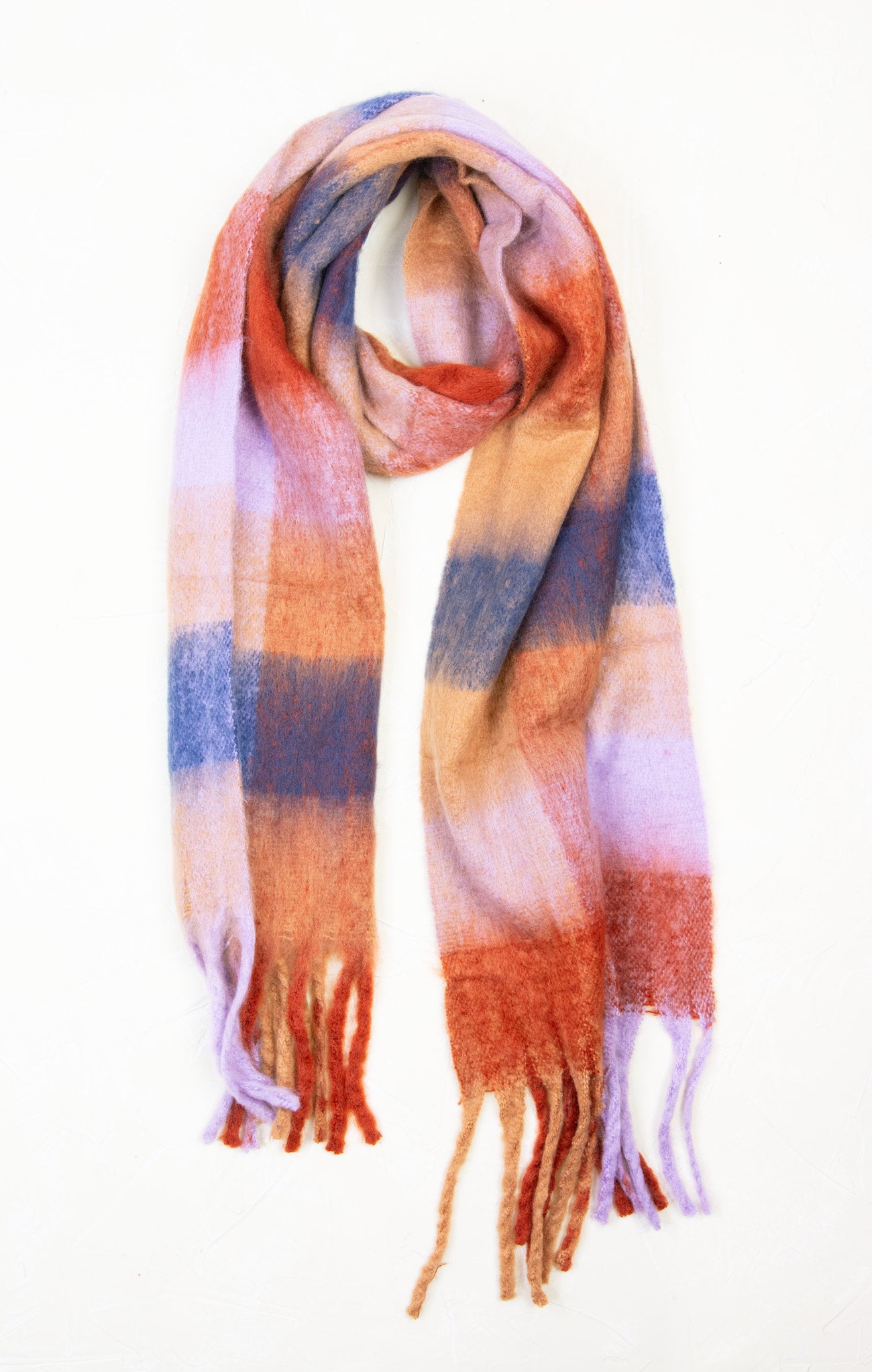 Multicolored plaid scarf with tassels on a white background