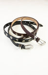 Two leather dog collars with studs on a white background