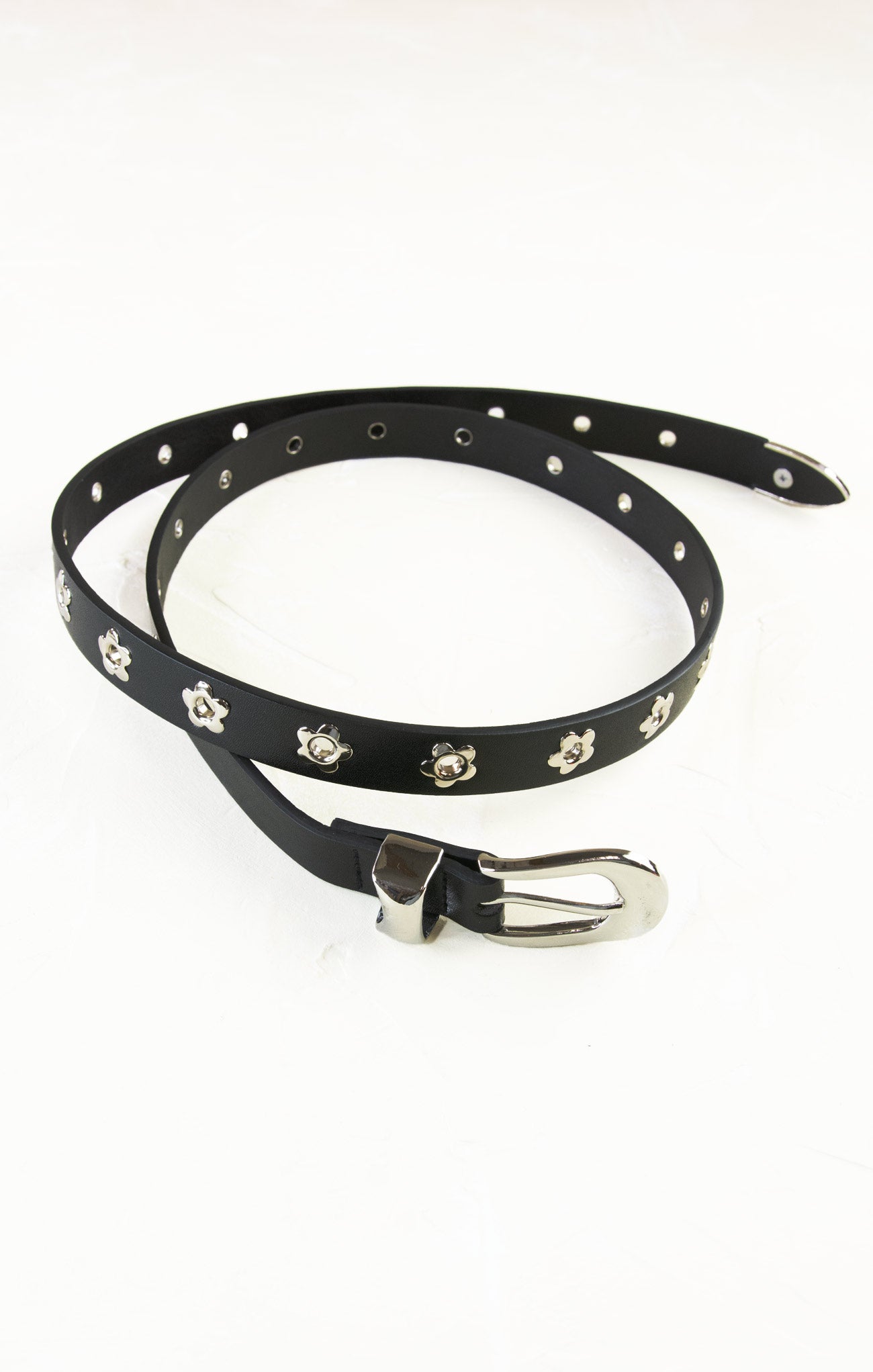 Black belt with silver studs on a white background
