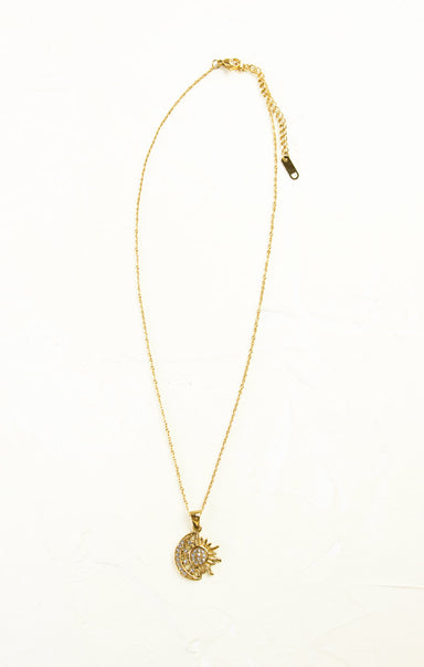 Gold necklace with a pendant on a white background