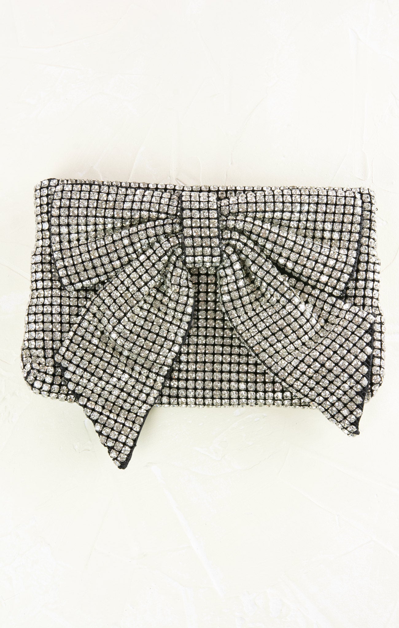 Black and white checkered clutch bag on a white background