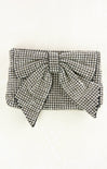 Black and white checkered clutch bag on a white background