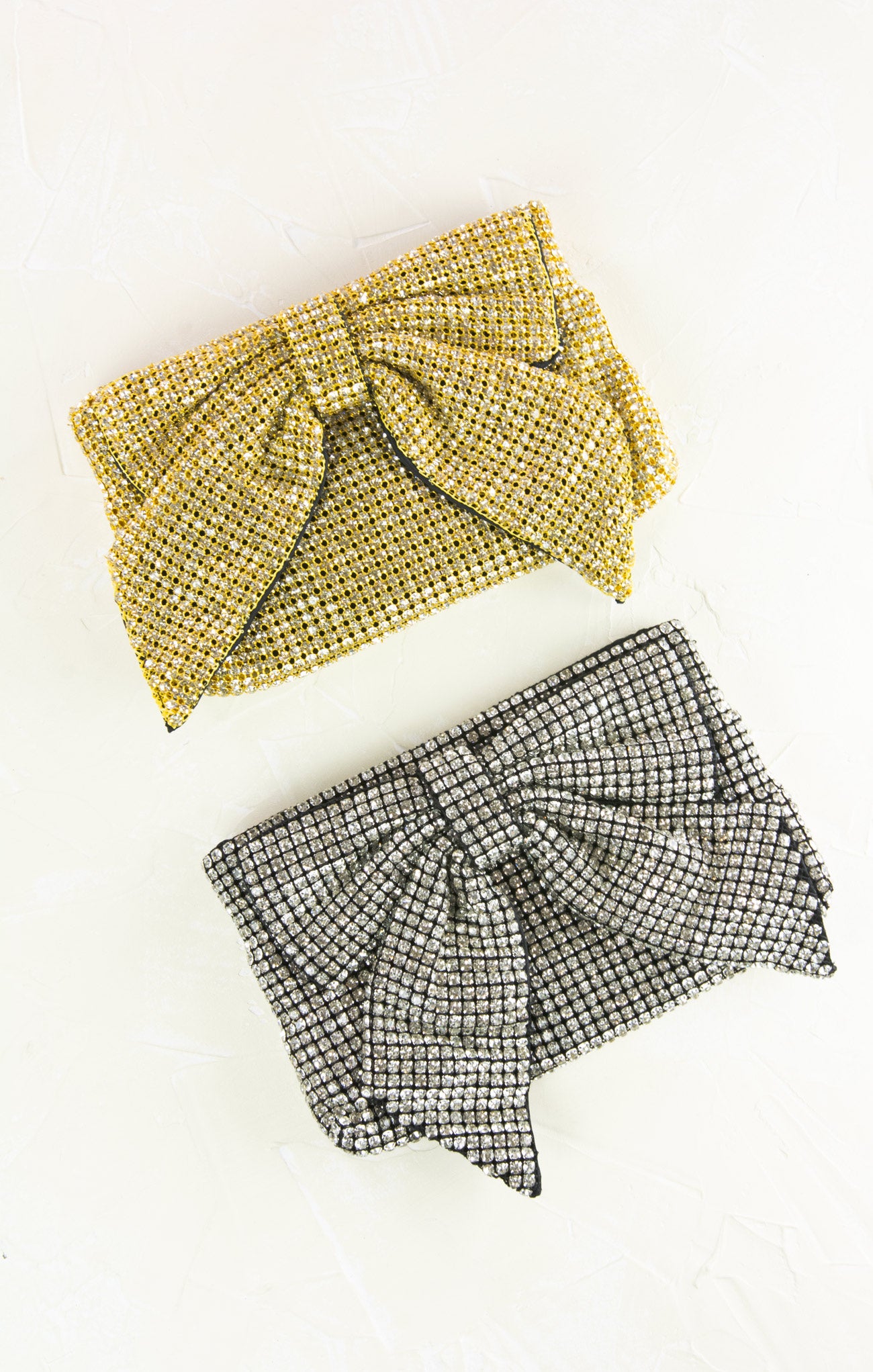 Gold beaded headband and black and white checkered shorts on a white background