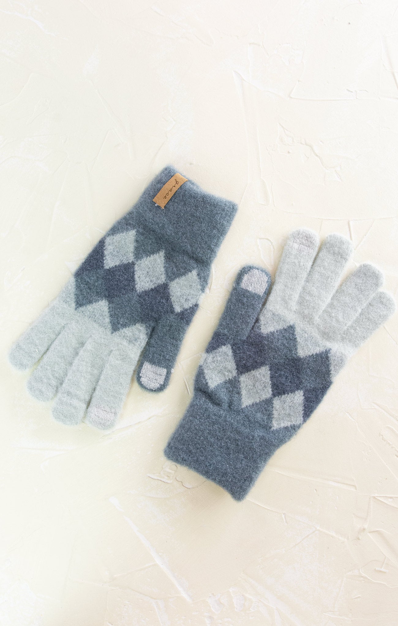 Pair of blue and gray checkered gloves on a white background