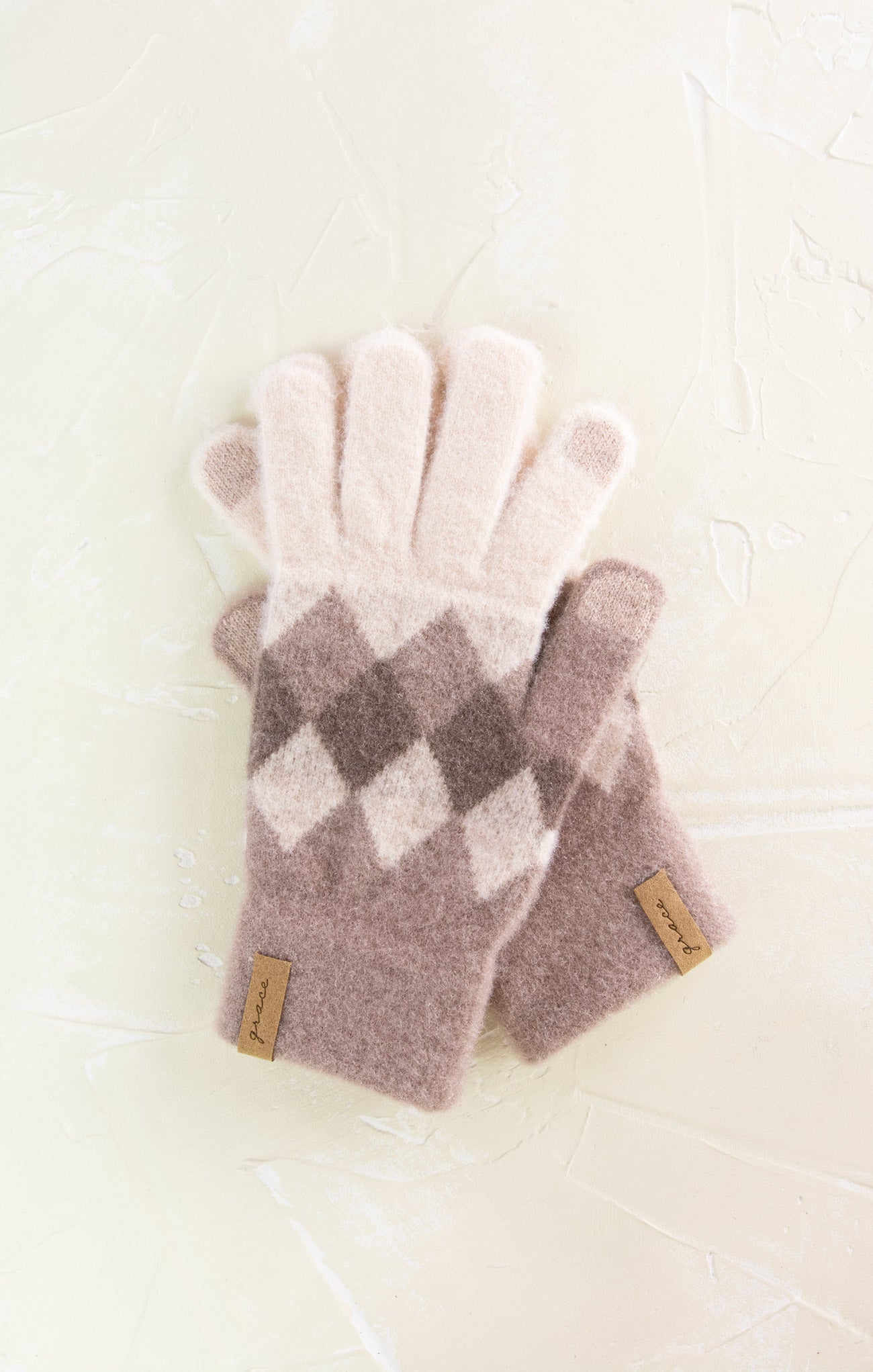 Pair of checkered fingerless gloves on a light background