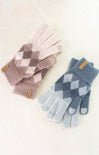 Pair of argyle patterned gloves in pink and blue on a white background