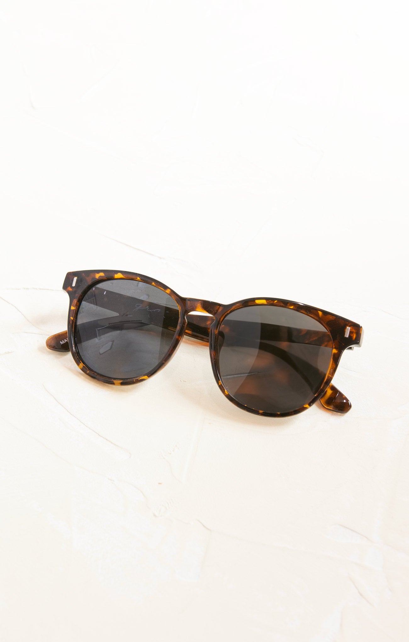 Tortoiseshell sunglasses on a white background