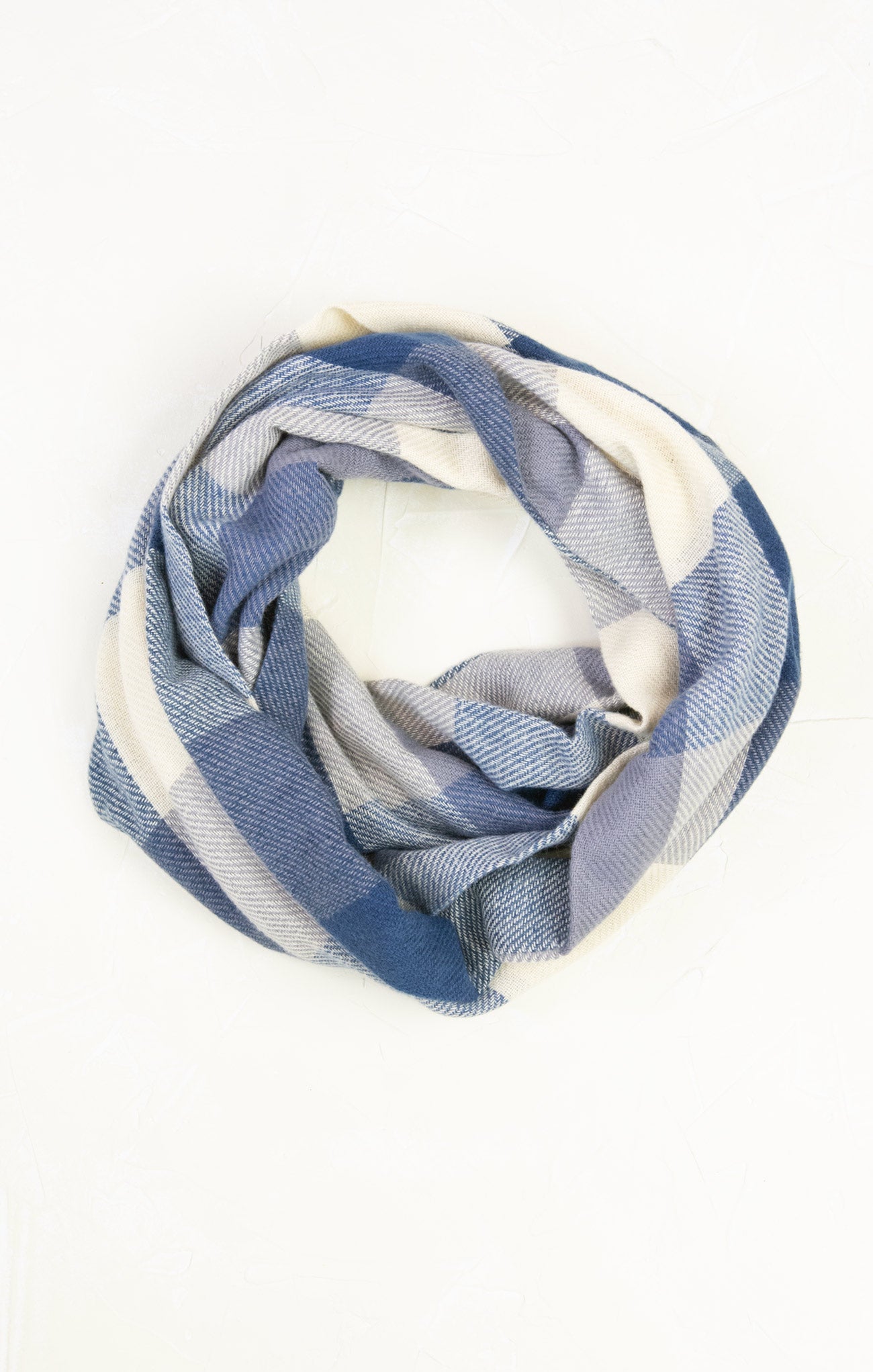 Blue and white checkered scarf on a white background