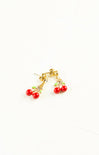 Cherry-themed earrings on a white background