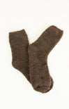 Pair of brown fuzzy socks on a white background