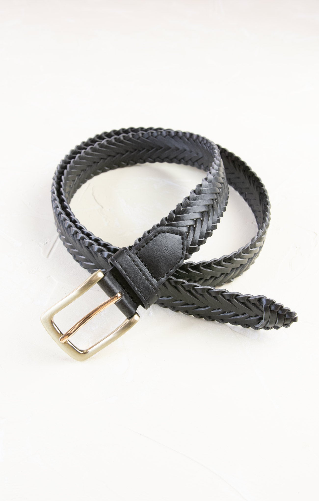 Black braided belt with a gold buckle on a white background