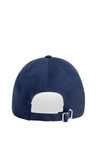Navy blue cap with a white patch on a white background