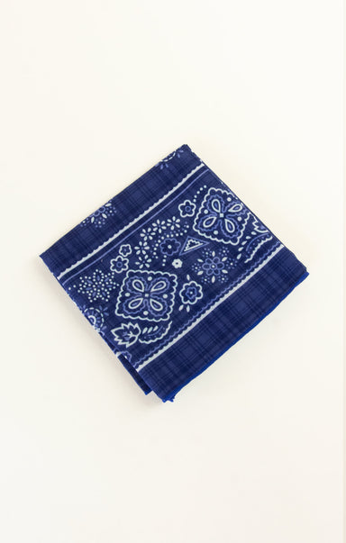 Blue bandana with white patterns on a white background